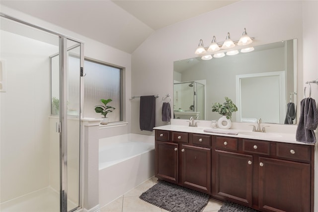 1805 Ringtail Dr, Little Elm, TX 75068 - bathroom with a shower stall, lofted ceiling, a garden tub, tile patterned floors, and double vanity