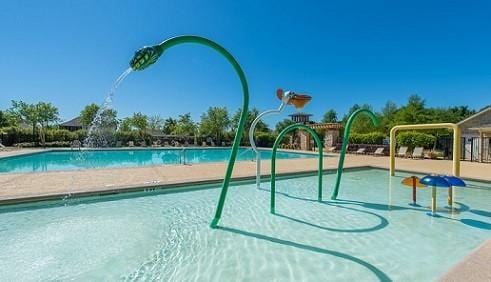 1805 Ringtail Dr, Little Elm, TX 75068 - community pool featuring a water play area