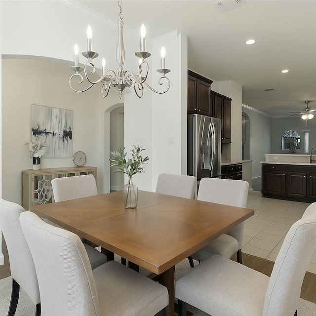 1805 Ringtail Dr, Little Elm, TX 75068 - dining area featuring arched walkways, ornamental molding, a chandelier, recessed lighting, and a ceiling fan