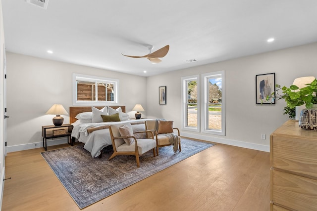 bedroom with recessed lighting, baseboards, and light wood finished floors