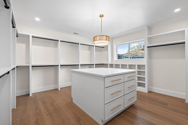 spacious closet featuring visible vents and light wood-style floors