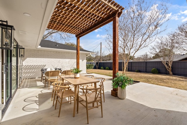 view of patio with a fenced backyard, a pergola, and outdoor dining space