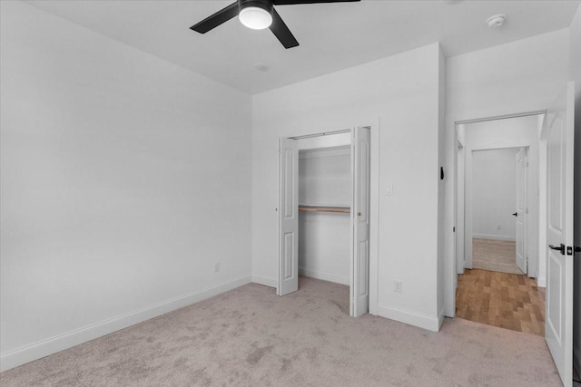 unfurnished bedroom featuring a closet, carpet flooring, ceiling fan, and baseboards