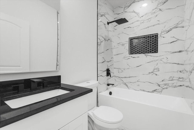 bathroom featuring tub / shower combination, vanity, and toilet