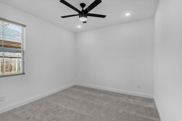 carpeted empty room featuring ceiling fan, recessed lighting, and baseboards