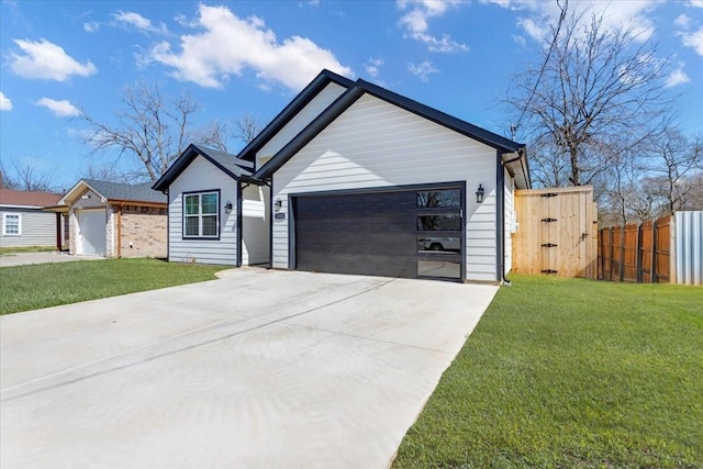 view of front of property with fence, concrete driveway, and a front yard