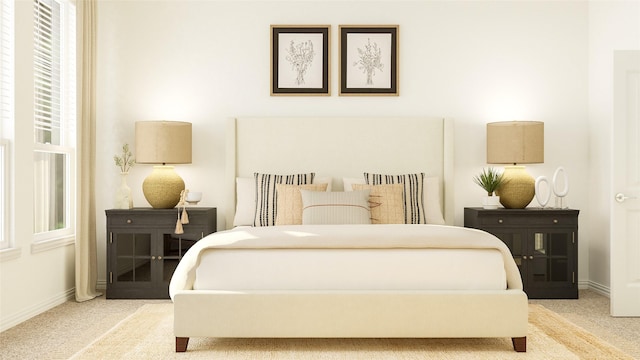 carpeted bedroom featuring multiple windows and baseboards