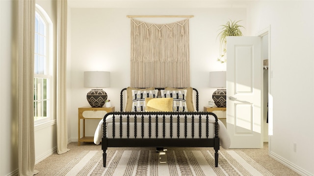 bedroom featuring multiple windows, carpet flooring, and baseboards