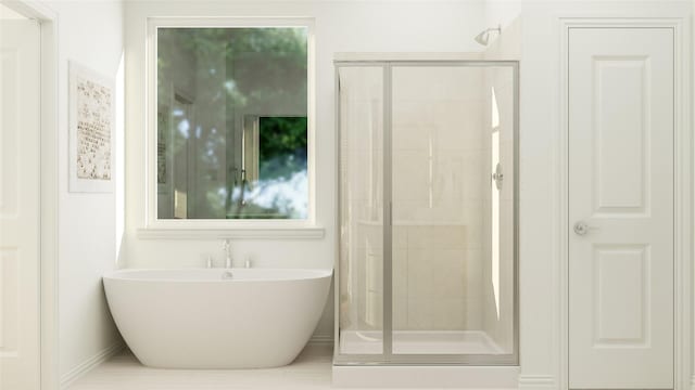 bathroom featuring a closet, a soaking tub, and a shower stall