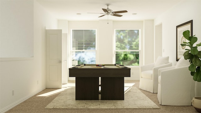 playroom featuring light carpet, baseboards, and a ceiling fan