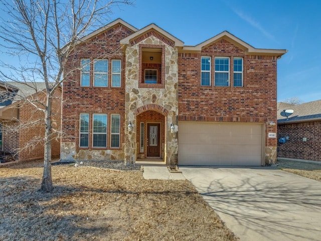 traditional home with an attached garage, stone siding, concrete driveway, and brick siding