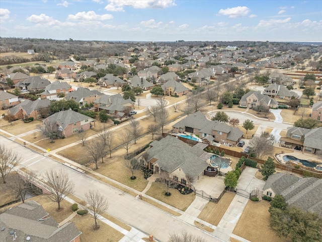 birds eye view of property with a residential view