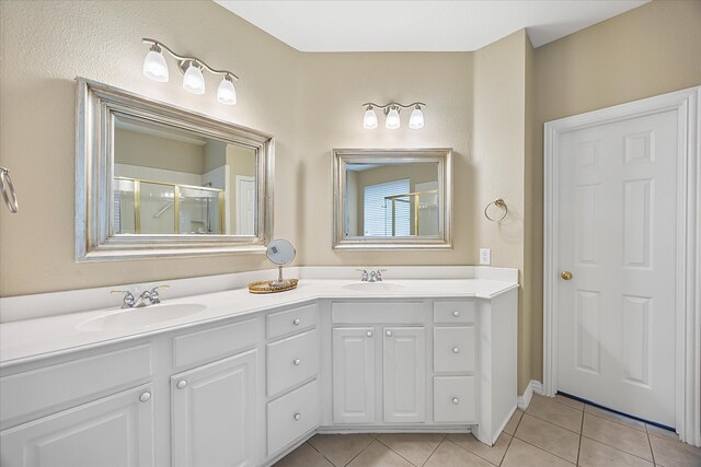 619 Loch View Ct, Rockwall, TX 75087 - bathroom featuring tile patterned flooring, a stall shower, and double vanity