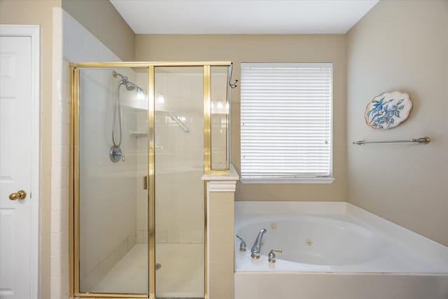 full bath featuring a stall shower and a tub with jets