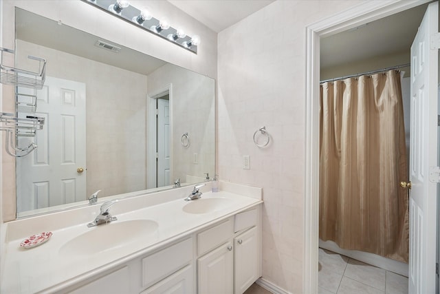619 Loch View Ct, Rockwall, TX 75087 - bathroom with tile patterned flooring, double vanity, and tile walls