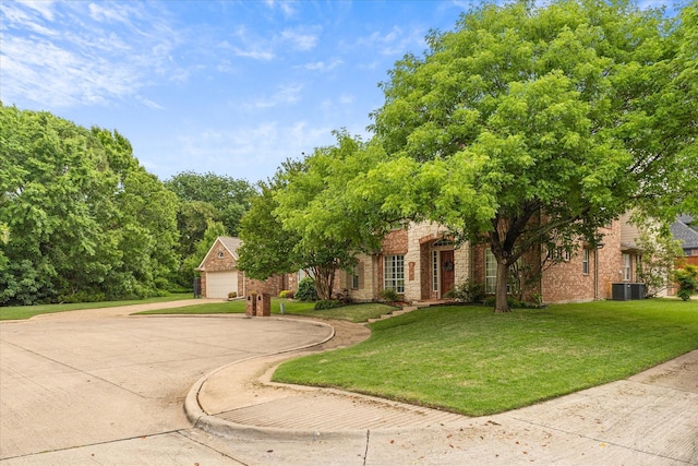 619 Loch View Ct, Rockwall, TX 75087 - view of front of home with central air condition unit, a front lawn, brick siding, and stone siding