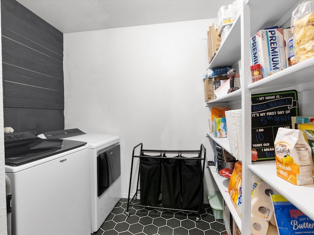 laundry room with laundry area and washing machine and clothes dryer