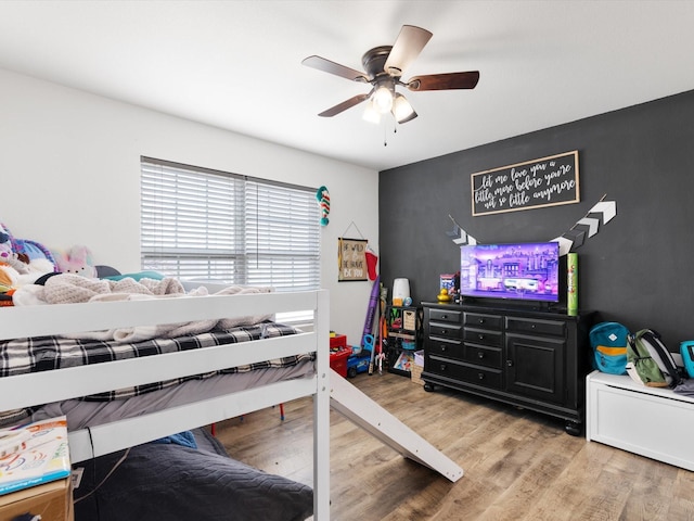 bedroom with ceiling fan and wood finished floors