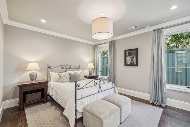 bedroom with recessed lighting, visible vents, baseboards, dark wood-style floors, and crown molding