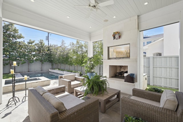 sunroom / solarium with wooden ceiling, ceiling fan, and an outdoor fireplace