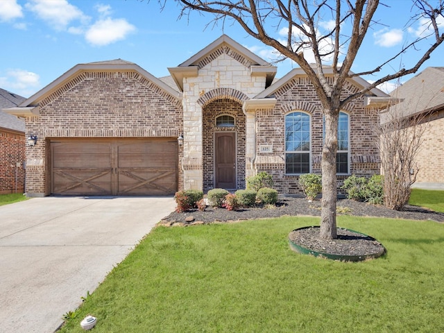 french country inspired facade with a garage, driveway, brick siding, and a front lawn