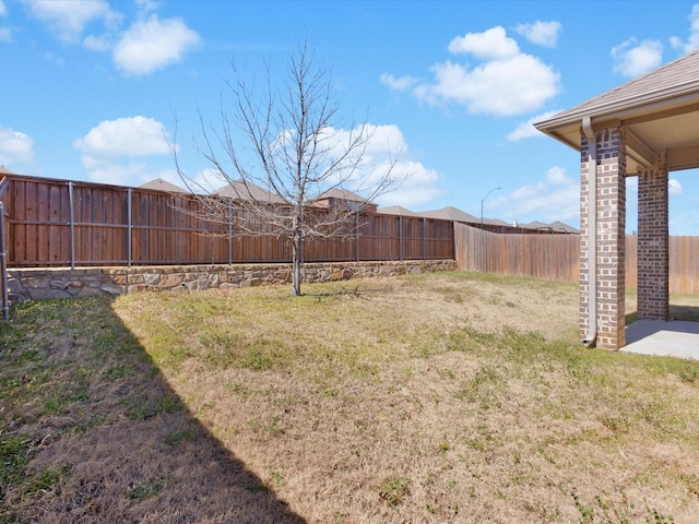 view of yard with a fenced backyard