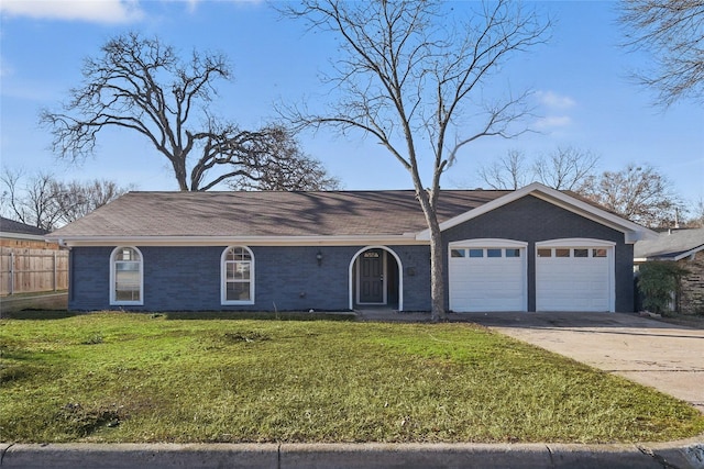 ranch-style house featuring driveway, a front lawn, and brick siding