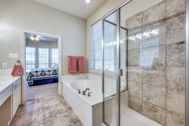 ensuite bathroom with a garden tub, a stall shower, connected bathroom, vanity, and ceiling fan