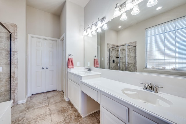 full bath featuring double vanity, a shower stall, a closet, and a sink