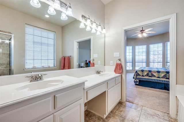 full bathroom featuring a sink, double vanity, ensuite bath, and a healthy amount of sunlight