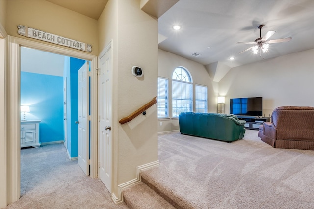 living room featuring visible vents, baseboards, light colored carpet, ceiling fan, and recessed lighting