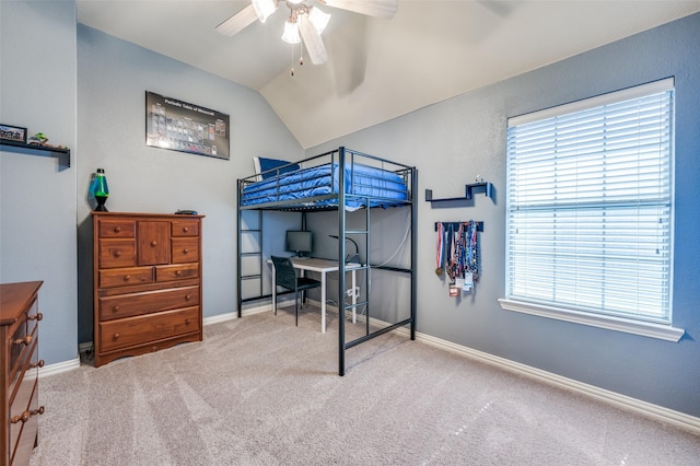 bedroom with vaulted ceiling, baseboards, and light colored carpet