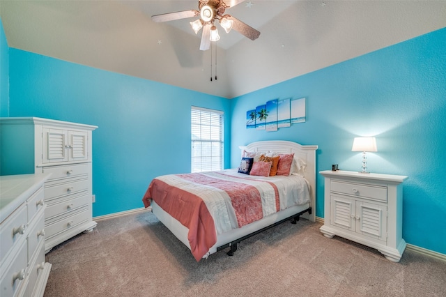 bedroom featuring lofted ceiling, light colored carpet, and baseboards