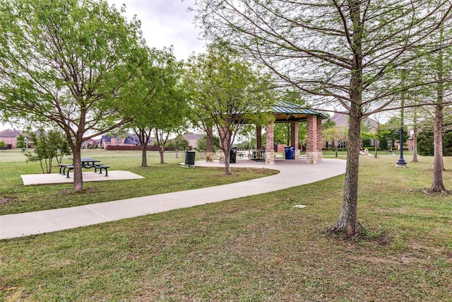 view of community with a lawn and a gazebo