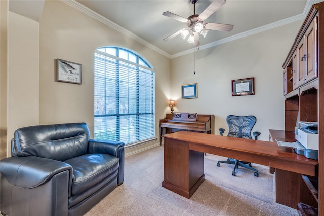 office area with light carpet, ceiling fan, baseboards, and crown molding