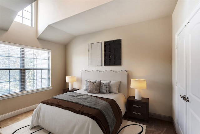 bedroom featuring carpet floors and baseboards