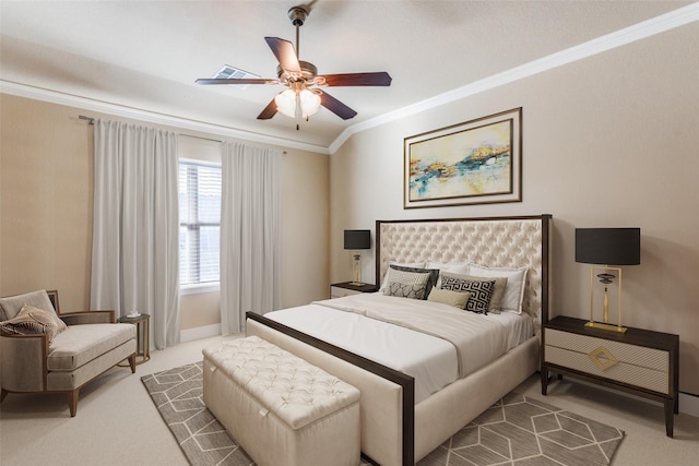 carpeted bedroom with visible vents, crown molding, baseboards, and ceiling fan