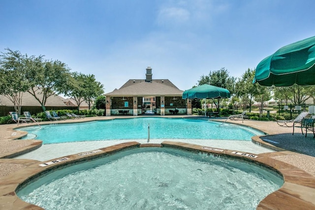 community pool featuring fence