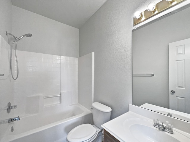 bathroom with a textured wall, toilet, vanity, and shower / tub combination