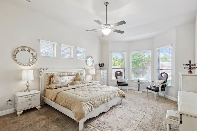 bedroom featuring a ceiling fan, dark carpet, and baseboards