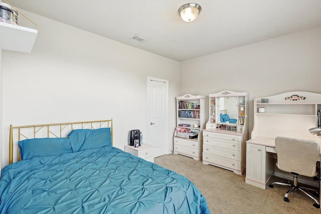 bedroom featuring visible vents and light colored carpet