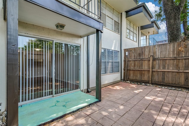 view of patio featuring fence