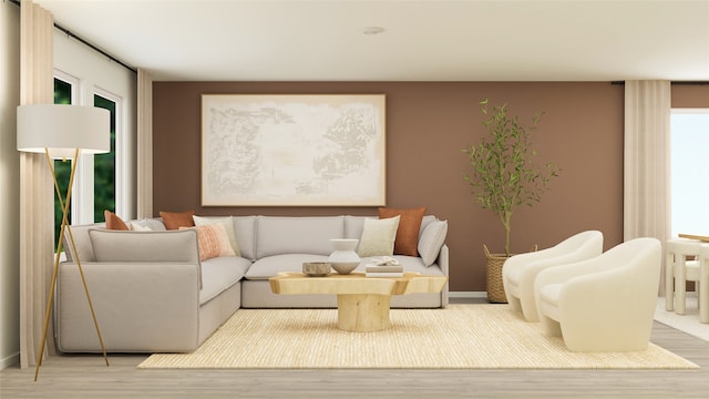 living room featuring light wood finished floors and baseboards