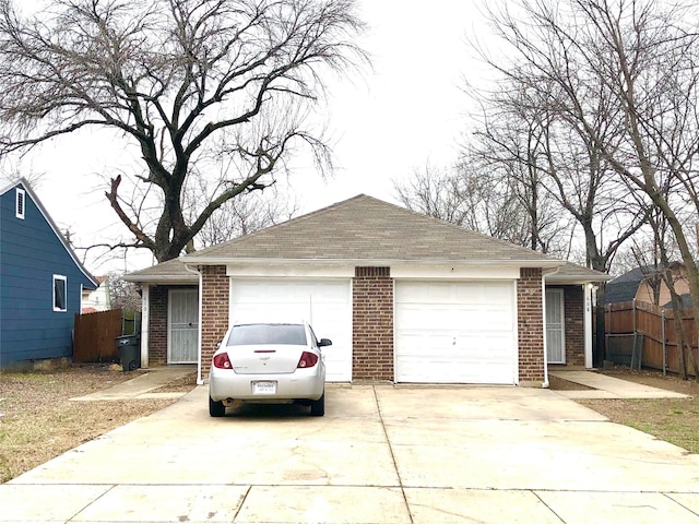 garage with concrete driveway