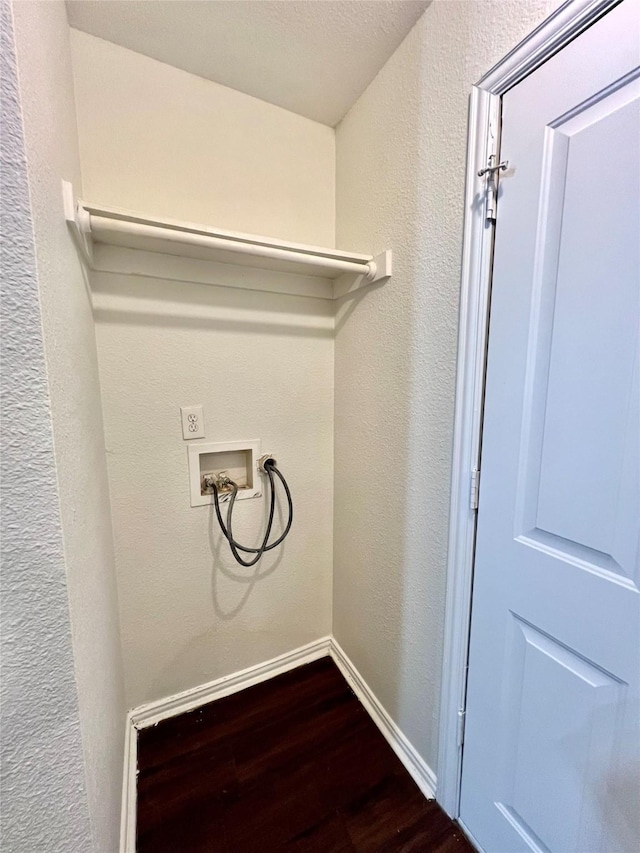 laundry room featuring washer hookup, a textured wall, wood finished floors, laundry area, and baseboards