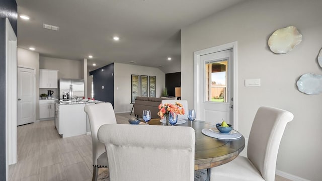 dining area featuring visible vents and recessed lighting