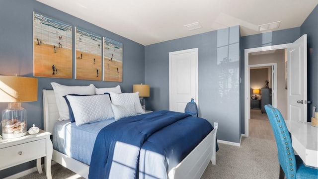 bedroom featuring light carpet, visible vents, and baseboards