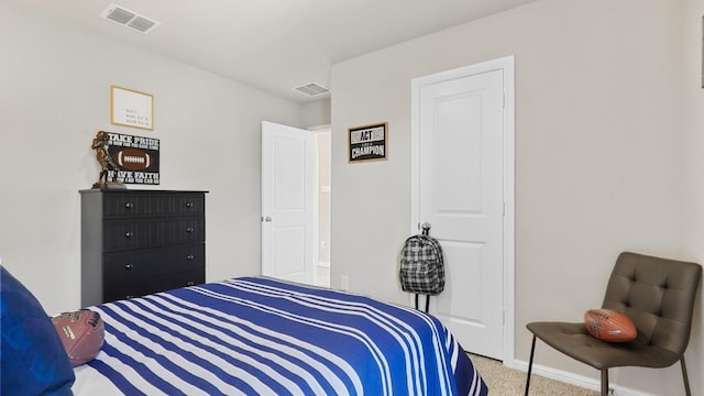 bedroom with carpet, visible vents, and baseboards