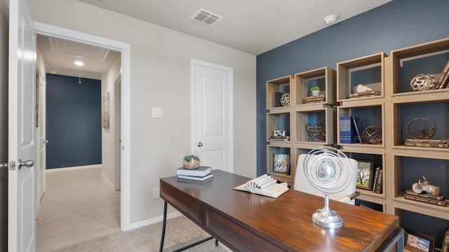 home office with baseboards, carpet flooring, visible vents, and attic access