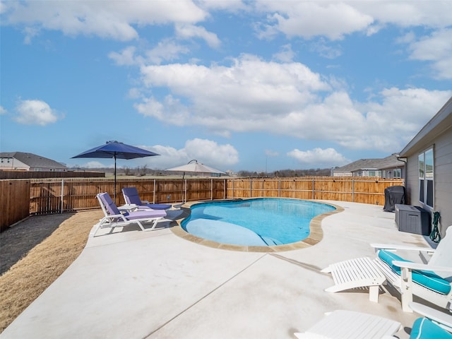 view of swimming pool with a fenced in pool, a patio area, and a fenced backyard